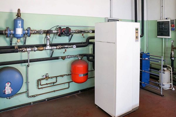 Geothermal HVAC system with connected pipes and tanks.