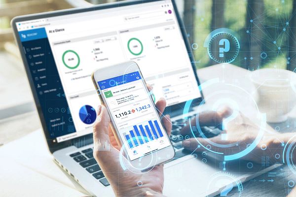 Person accessing water meter data information on their phone and desktop