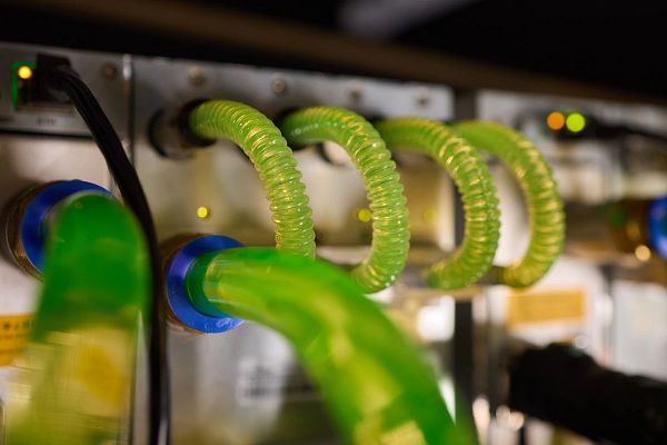 Close-up view of modern server hardware with liquid cooling pipes maintaining optimal temperature control in data center.