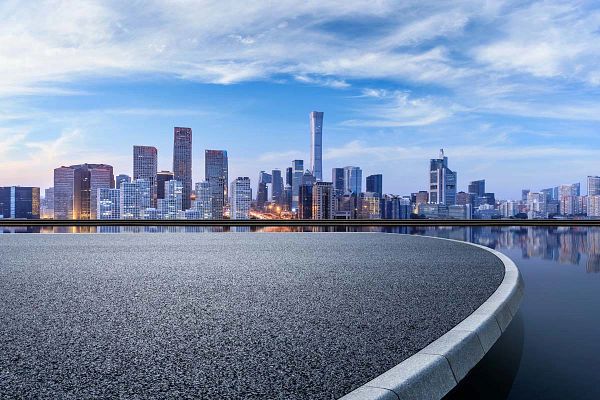 Panoramic skyline and modern commercial buildings with empty circular square in Beijing, China.