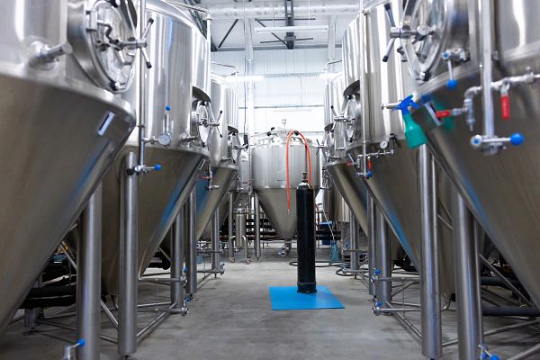 Interior of a brewery with big metal vats