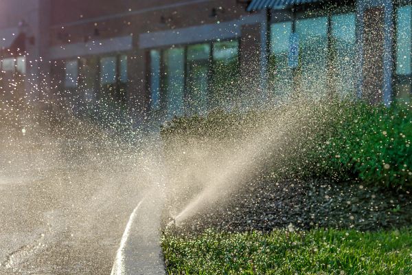 Automated sprinkler system at outdoor shopping center